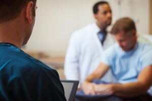 Hospital scene with a nurse, doctor, and patient